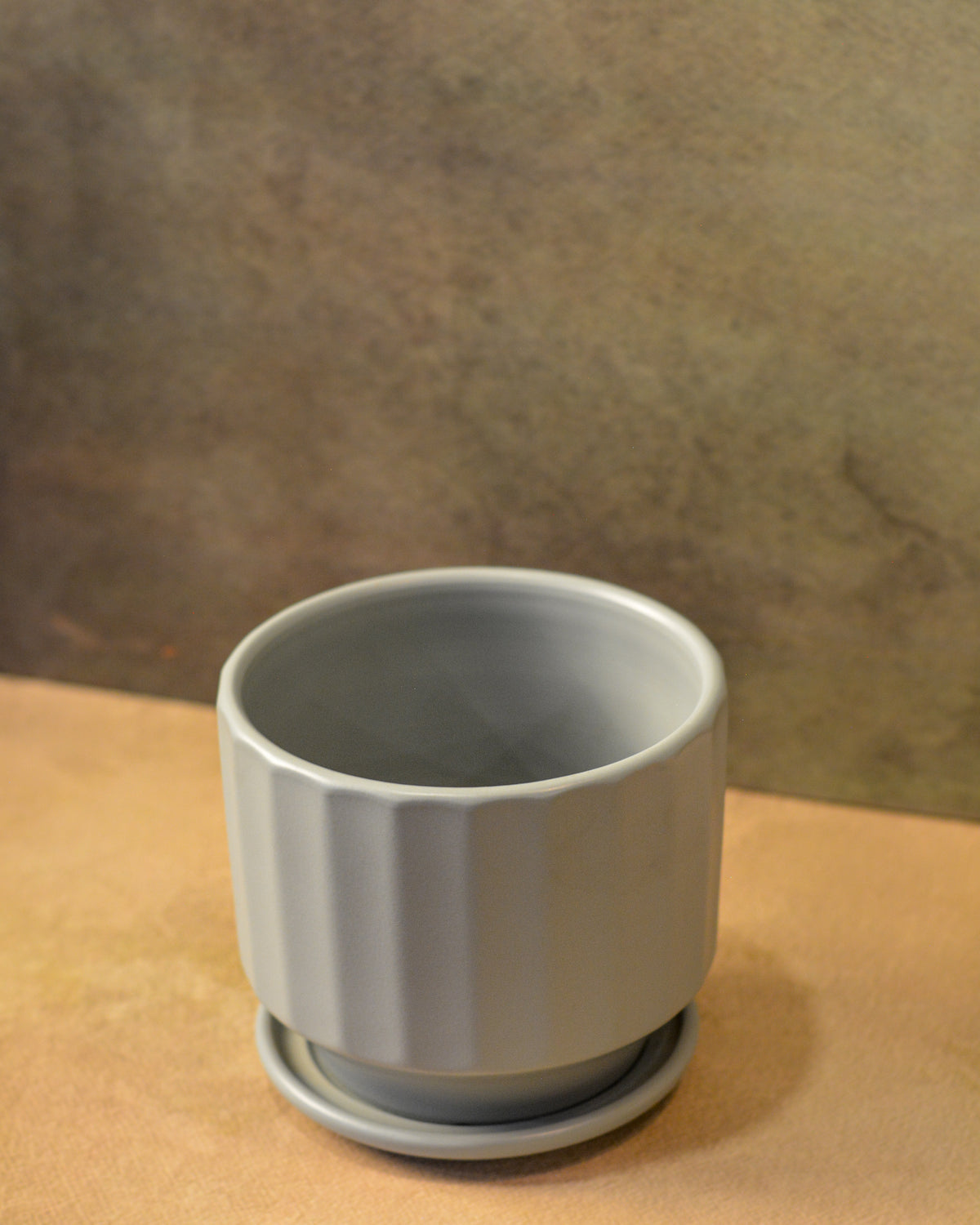 Fluted Ceramic Planter with saucer comes with a drainage hole, Grey